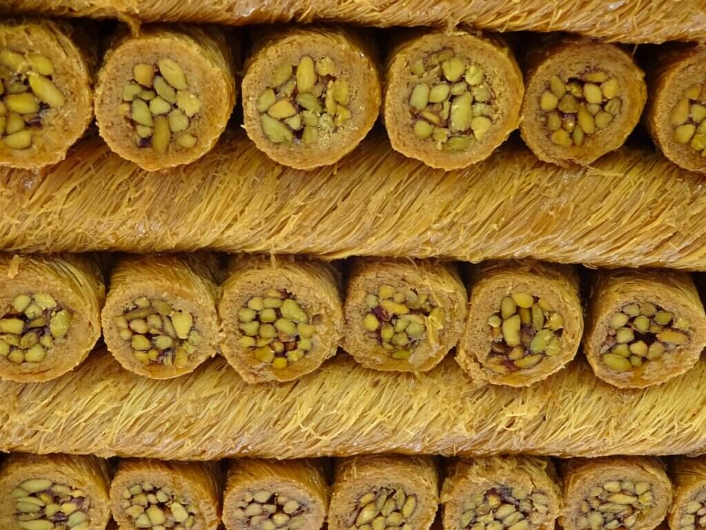 Kadayıf Dolmasi is a sweet dish, which is prepared from Kadayif noodles and filled with pistachios or walnuts. Photographed in Istanbul in a bakery in Taksim